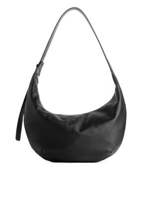 Curved Leather Bag - Black - recommended by Naji Basma