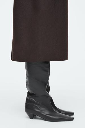 black tall boots - recommended by Claire Rose